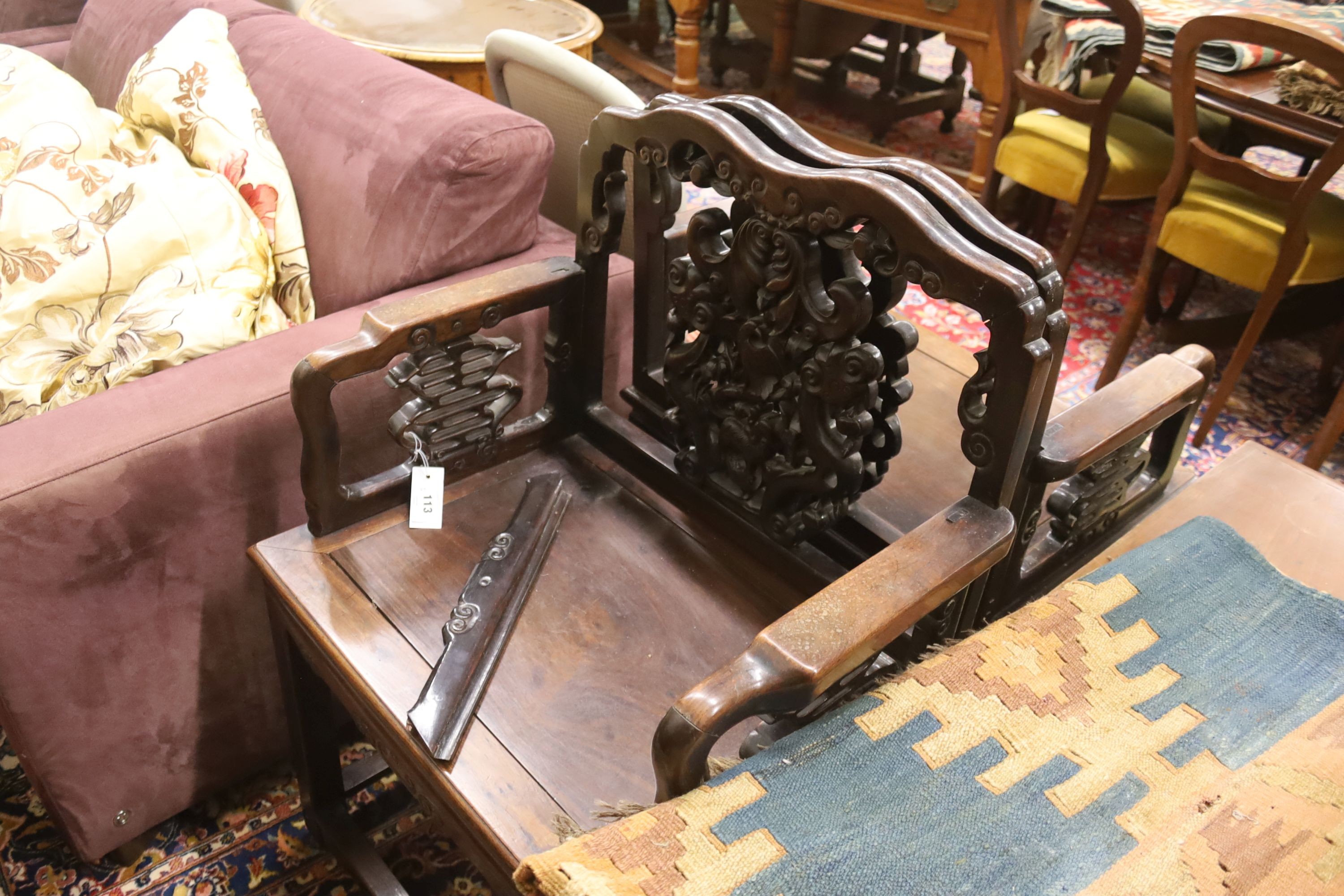 A pair of Chinese carved hongmu elbow chairs (a.f.), width 65cm, depth 48cm, height 96cm